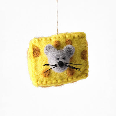A yellow felt cheese-shaped ornament with brown spots and a gray felt mouse character in the center, hanging from a thin string against a plain white background.