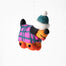 A handmade felt dog ornament wearing a pink and teal plaid sweater and a teal and white beanie hat, hanging against a plain white background.