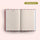 Open notebook with lined pages on a light beige background