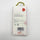 The back of a white product box with a gold hanging loop, featuring an instruction for use, a barcode, a red flower graphic, and the brand name HOUSEOFDISASTER.